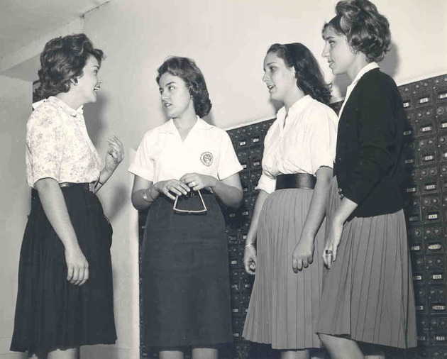 Students standing in front of college mailboxes in Adrian Hall
